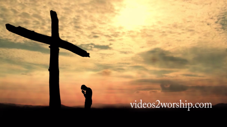 Read more about the article Man Kneeling And Praying At The Cross