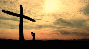 Read more about the article Kneeling At The Cross Still Background