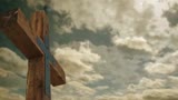 Large Wood Cross And Moving Clouds