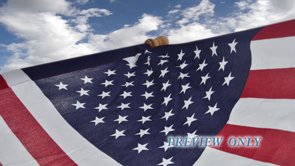 Read more about the article American Flag And Moving Clouds Motion