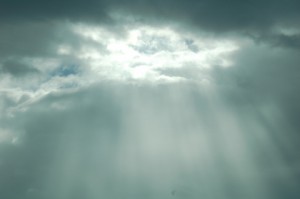 Read more about the article Light Piercing Through The Clouds: Still Background