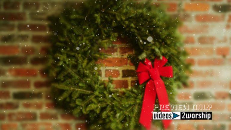 Read more about the article Christmas Wreath On A Brick Wall And Snow