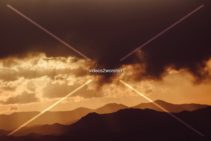 Read more about the article Stock Photography: Clouds Over Mountains